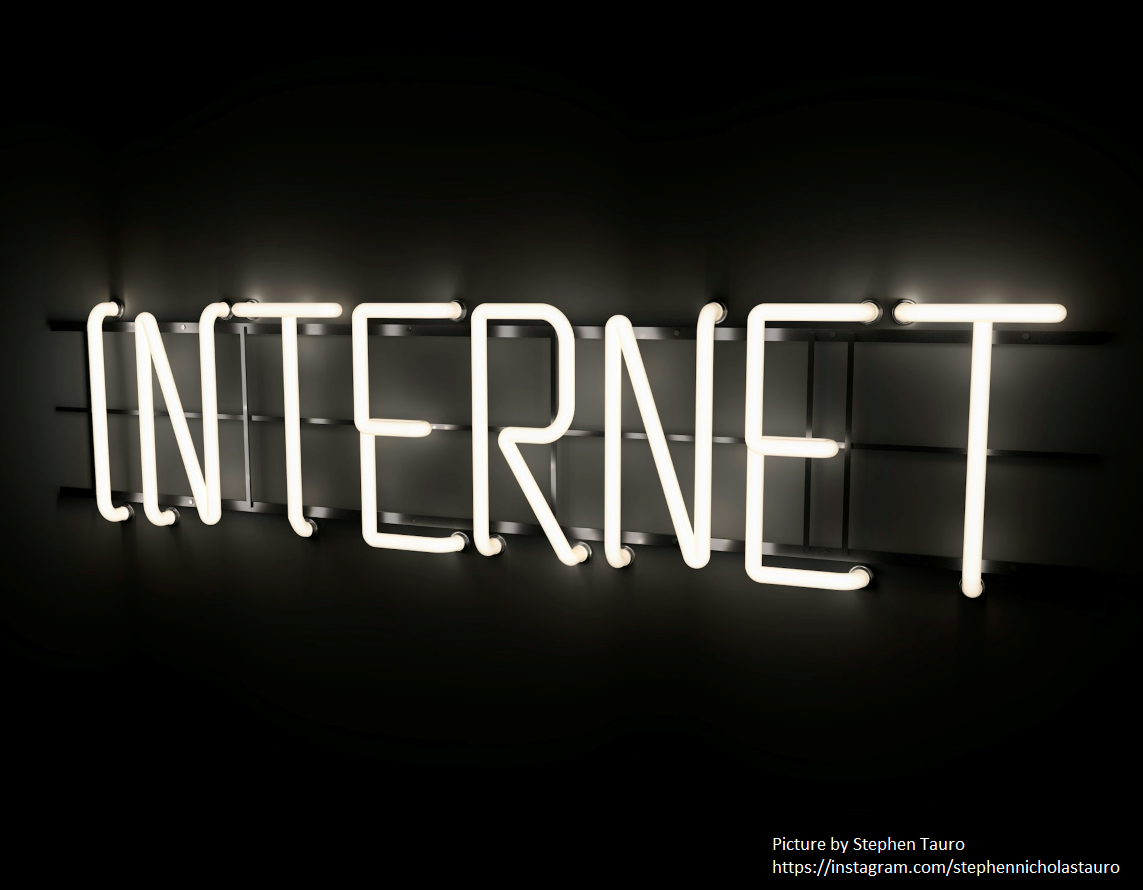 Internet written in lights with a dak background