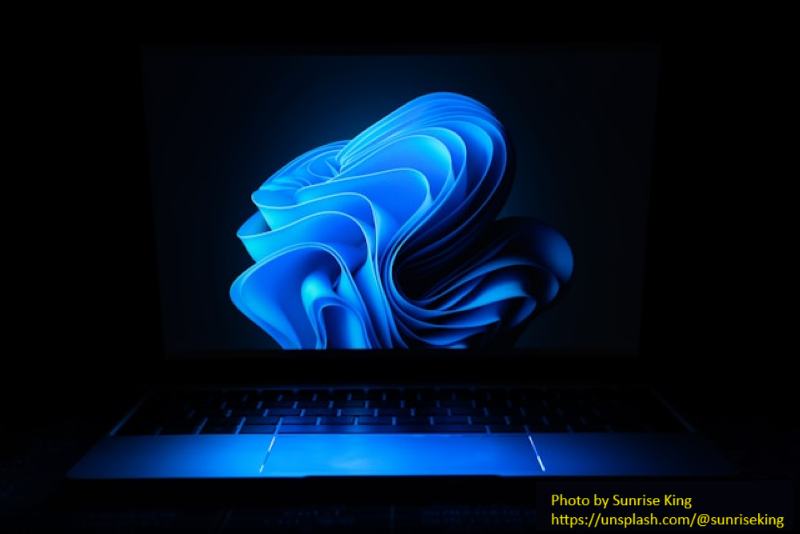 windows 11 logo shading over a keyboard